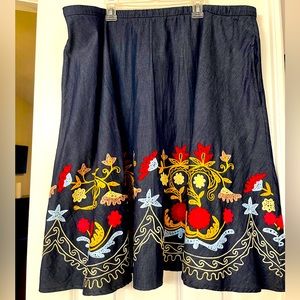 Denim skirt with embroidery design.
